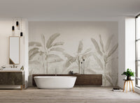 Banana leaf wall mural depicting a tropical garden in bright bathroom.