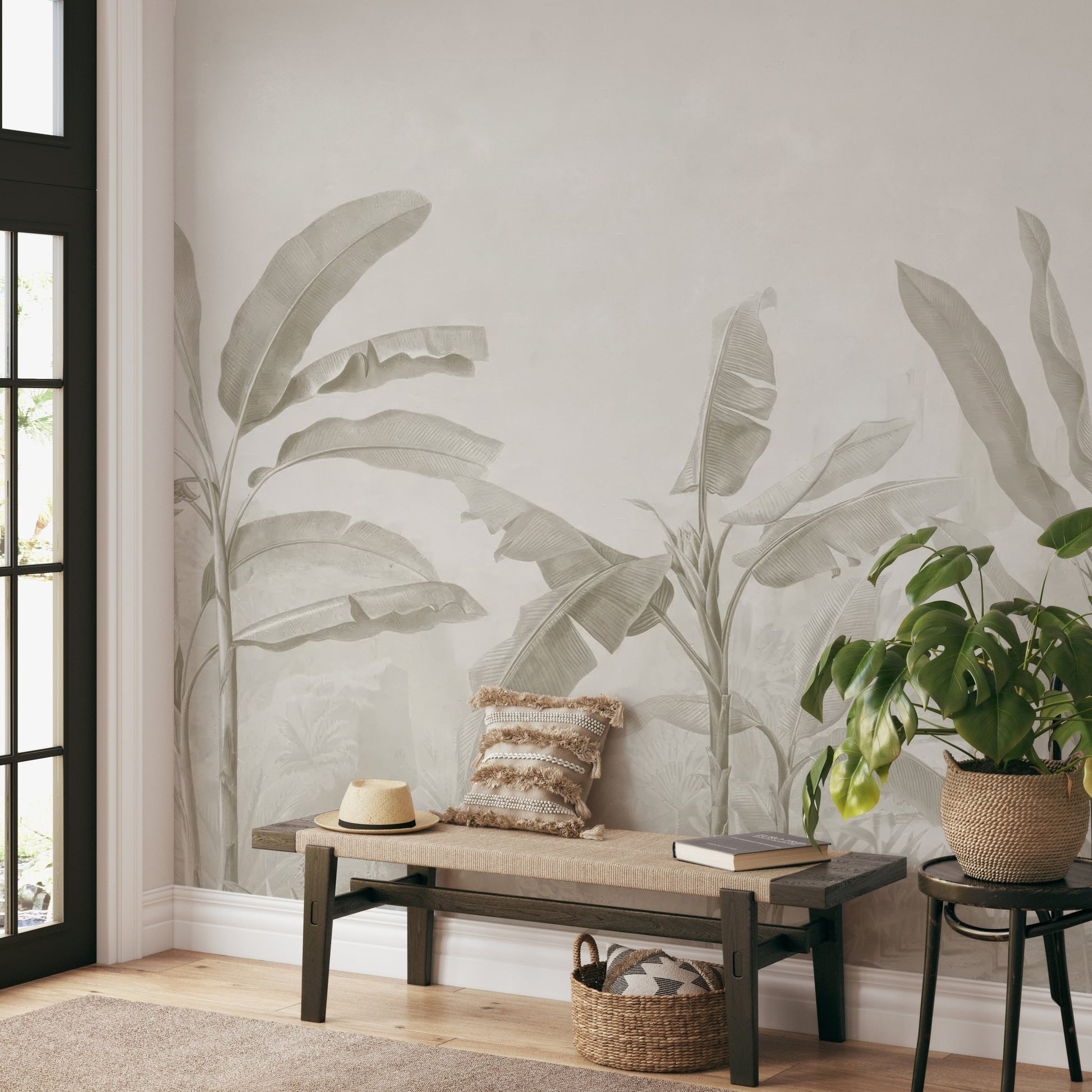 Large banana leaves mural with soft, natural hues for hallway interior.