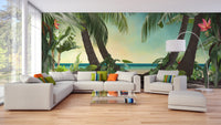 Spacious living area featuring a seaside nature wallpaper mural and white seating.