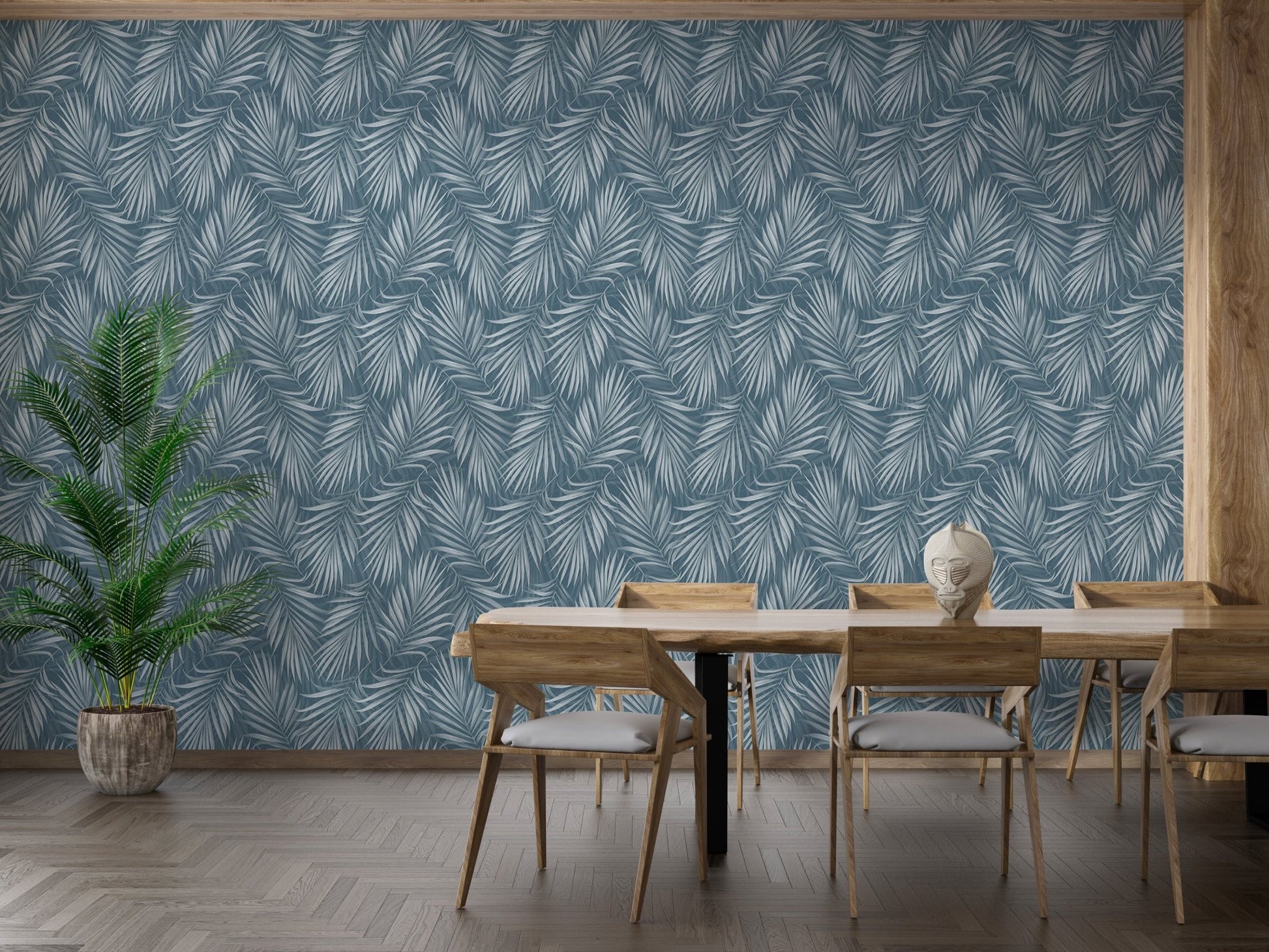 Dining room featuring a blue palm leaf wallpaper and wooden furniture.