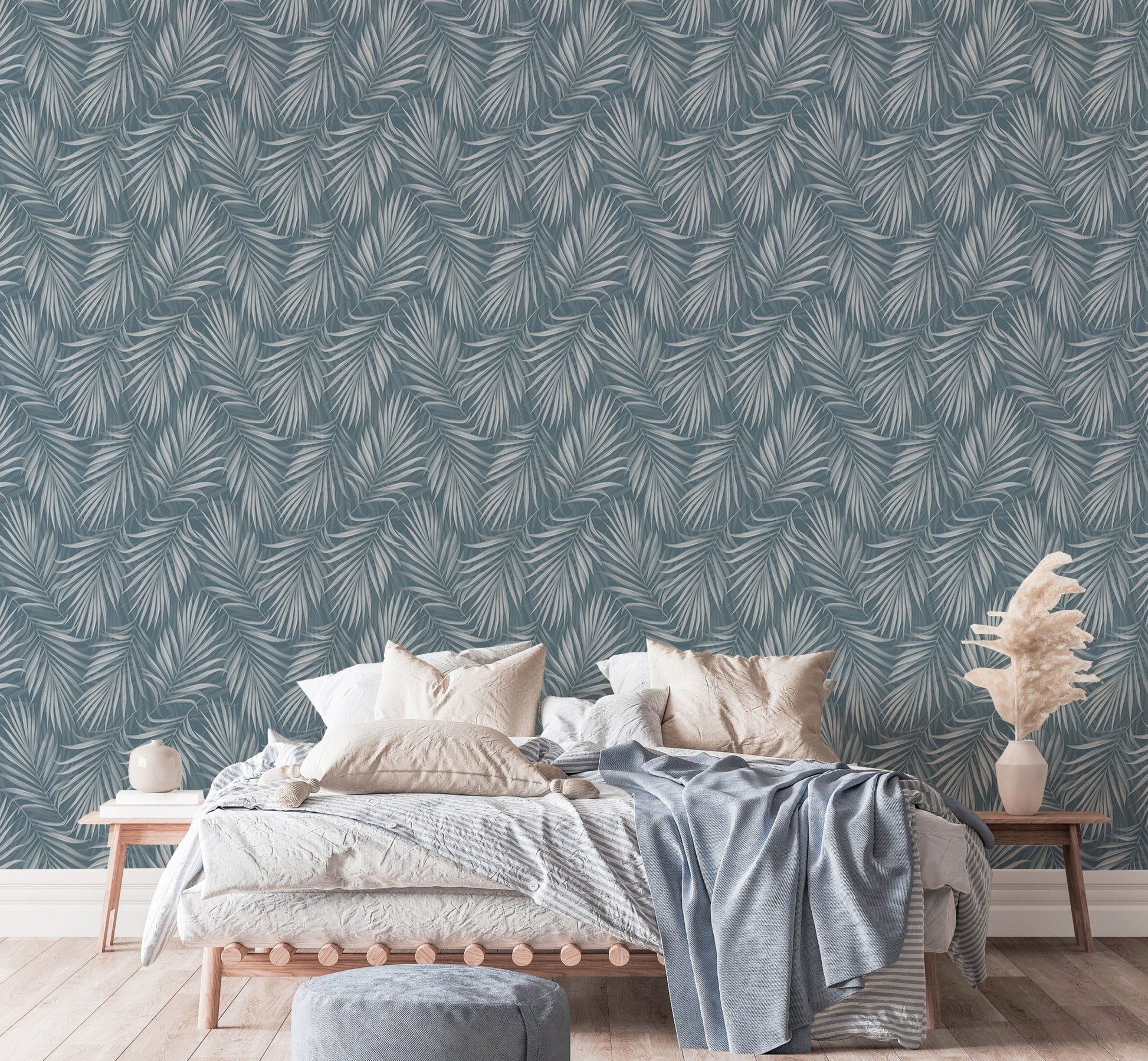 Tropical Exotic Palm Leaves Vintage Illustration Wallpaper behind a bed with grey pillows.