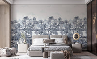 Detailed blue forest leaf wall mural in a modern bedroom with grey bed.