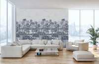 Blue and grey tropical forest wall mural used as a living space backdrop. 