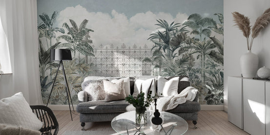 Ornate garden gate wallpaper with tropical plants and soft white clouds.