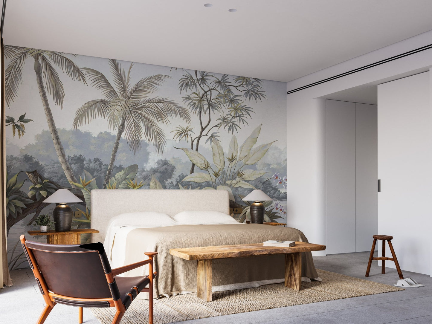 Large bedroom with a beige bed and muted tropical forest wall mural.