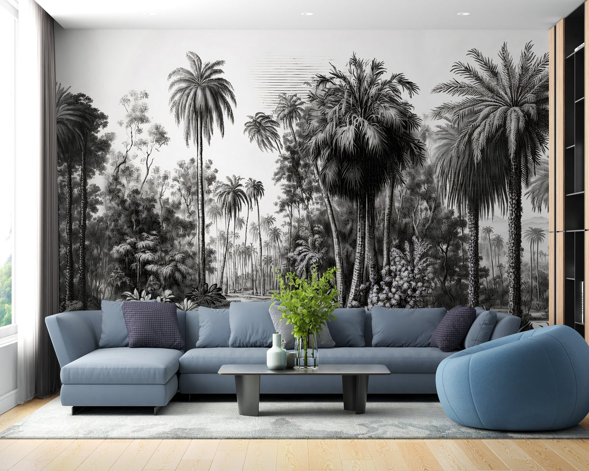 Lounge area with a blue L-shaped sofa and monochrome forest wall mural.