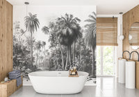Bathroom featuring a white bathtub against a grey palm tree wall mural.