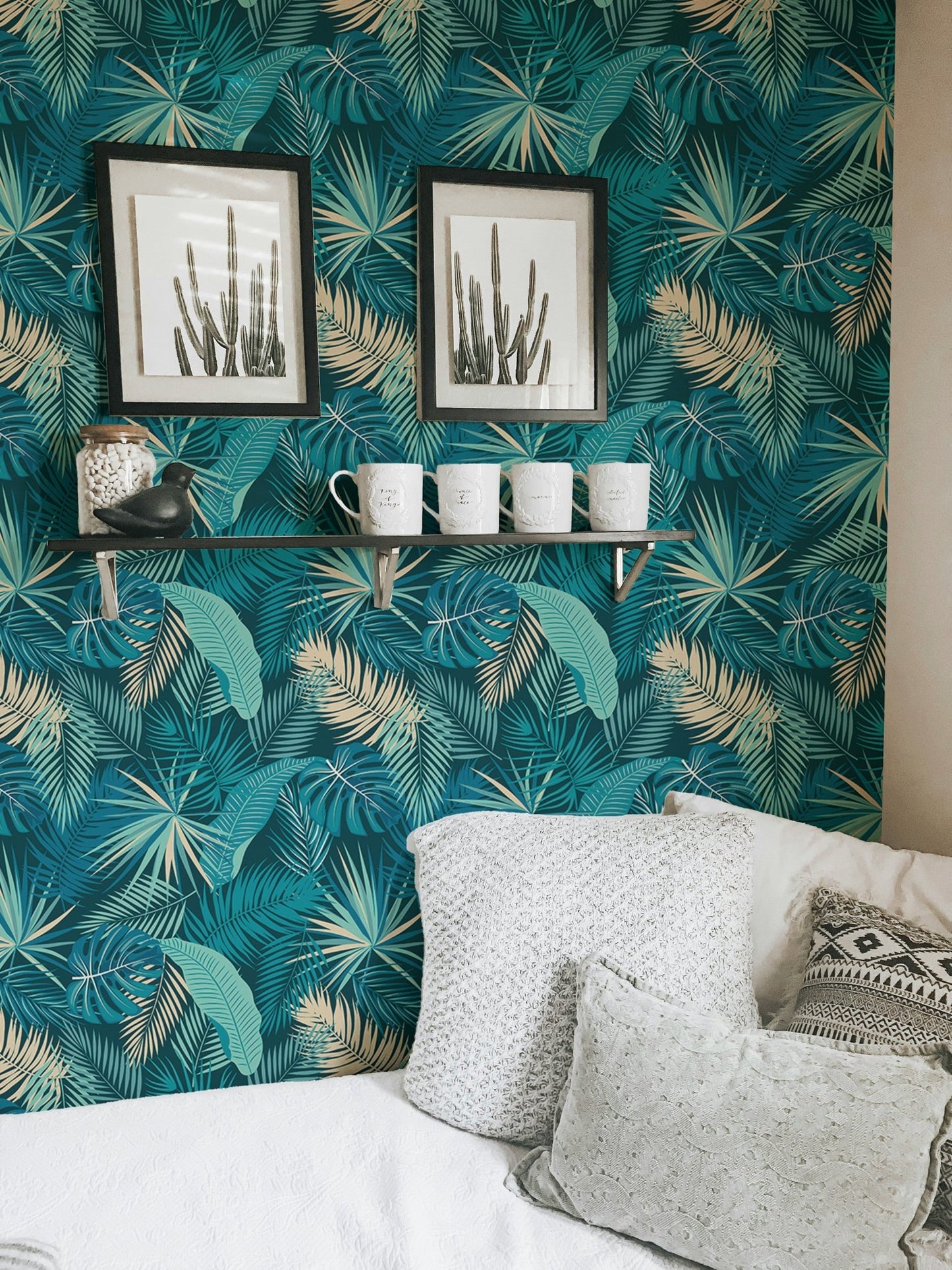 Seamless botanical palm wallpaper in living room with black frame.