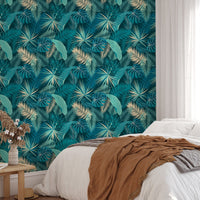 Tropical jungle wallpaper behind white bed in bedroom.