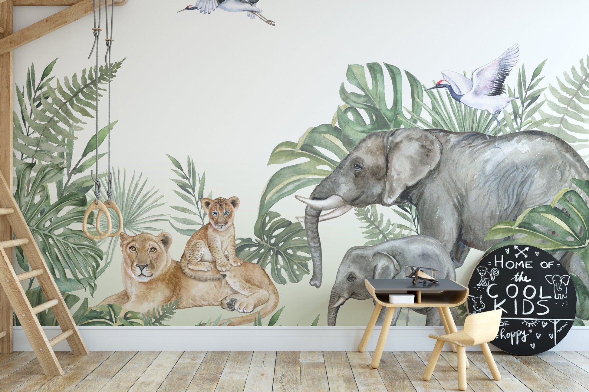 Jungle animal wall mural in a playroom with a swing and wooden stool.