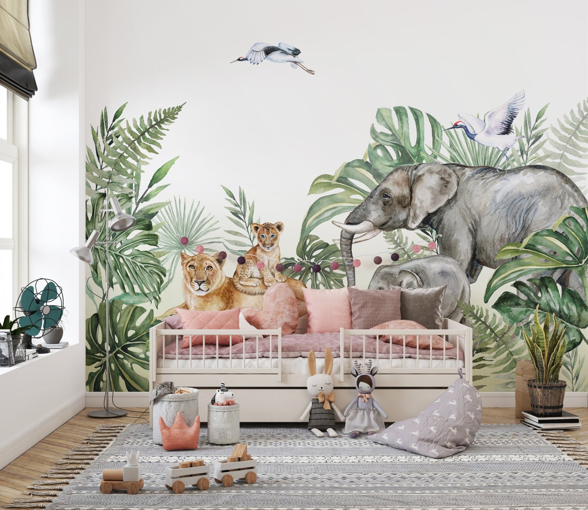 Neutral toned playroom featuring tropical jungle wall mural and soft toys.