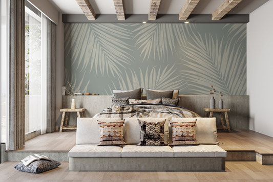 Tropical palm leaf wallpaper mural in muted sage and ivory tones.