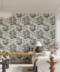 Tropical palm tree wallpaper in a living room with a sofa and wooden furniture.