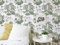 Tropical Palm Trees Flamingo Jungle Toile Wallpaper behind a bed with white pillows.
