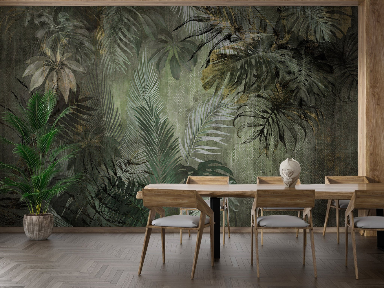 Large tropical leaf wall mural in a dining space with wooden chairs and plants.
