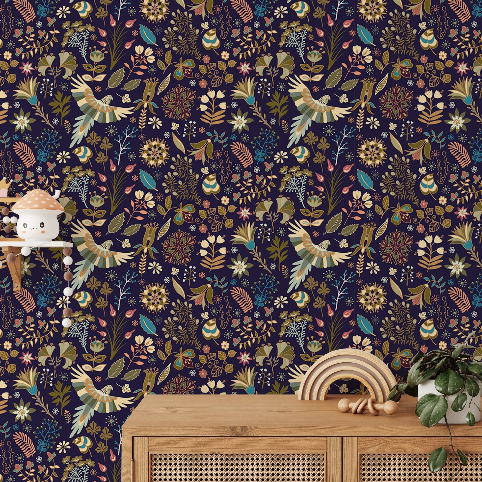 High-detailed botanical flower wallpaper behind a wood side table and green plant.