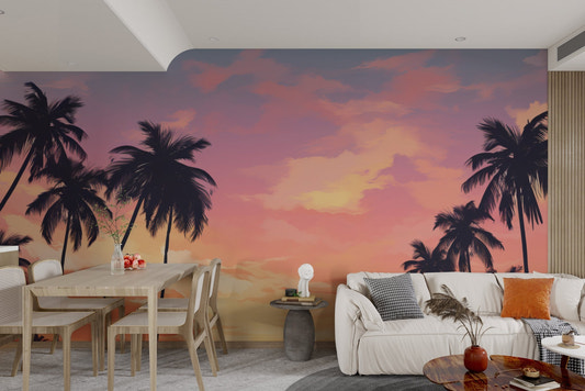 Sunset palm tree wallpaper with orange and pink clouds.