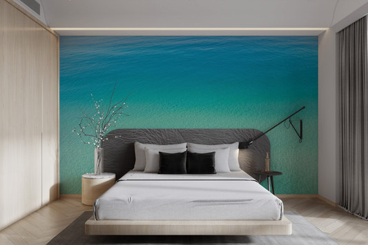 Turquoise ocean view wallpaper featuring clear sea ripples and sandy textures.
