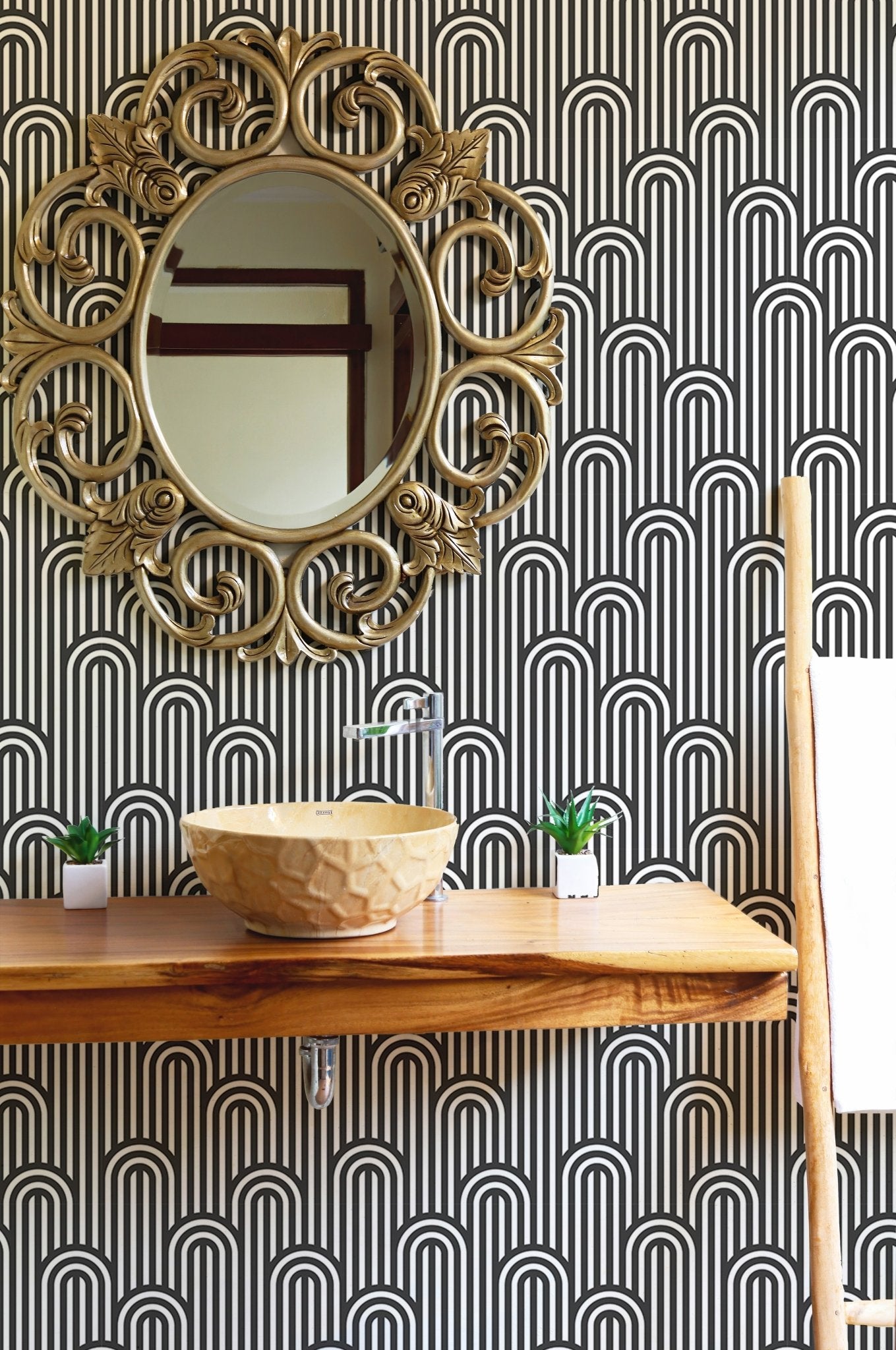 Stripy weaving black and white wallpaper behind a bathroom vanity and mirror