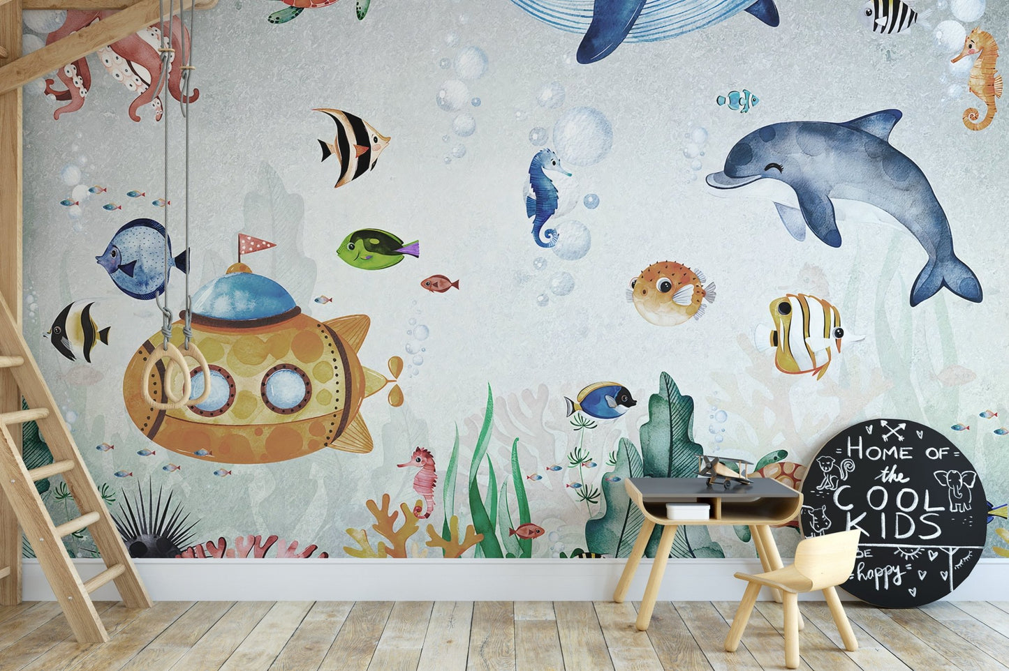 Blue marine themed wall mural with tropical fish in a minimalist playroom.
