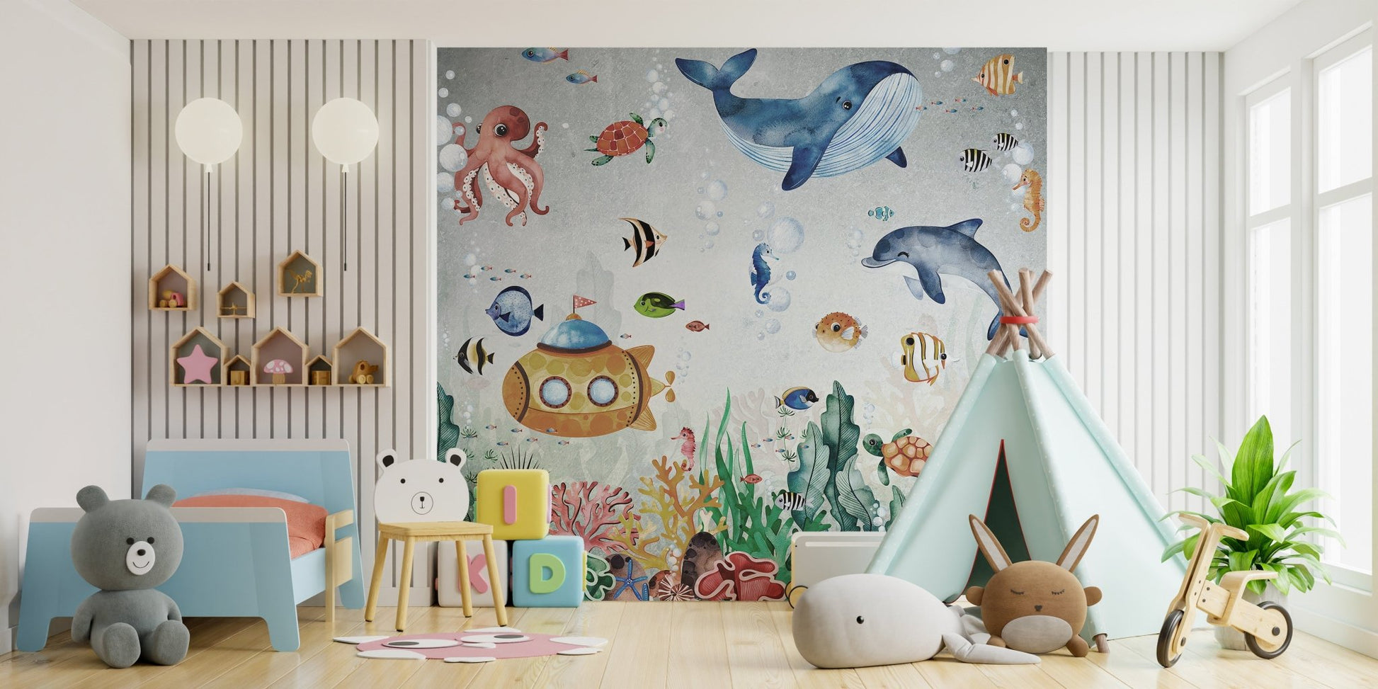 Marine life wall mural featuring colorful fish in a child's bedroom with white play tent