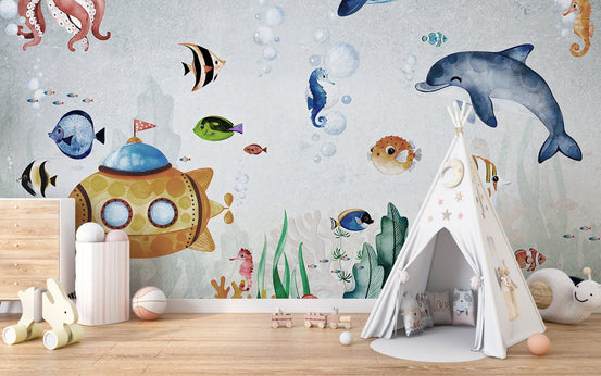 Fish-themed underwater wall mural for kids play room with small white tent.
