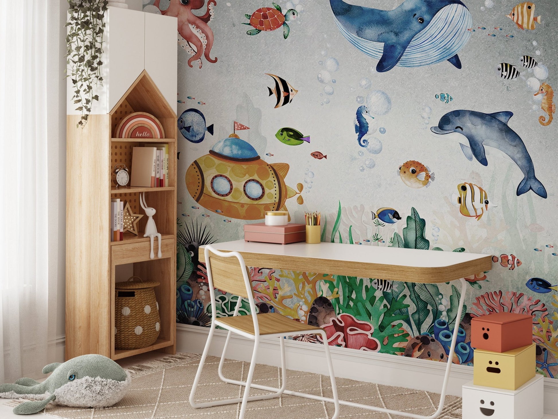 Detailed marine life wall mural behind a study desk and chair setup.