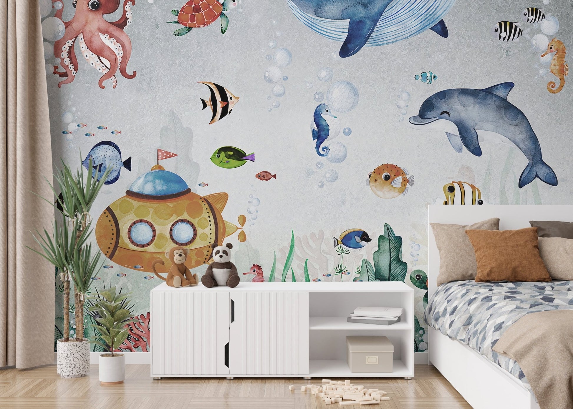 Blue water wall mural with aquatic animals in a room with a white storage cabinet.
