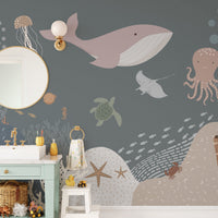 Grey ocean life wall mural with jellyfish and octopus in a modern bathroom.