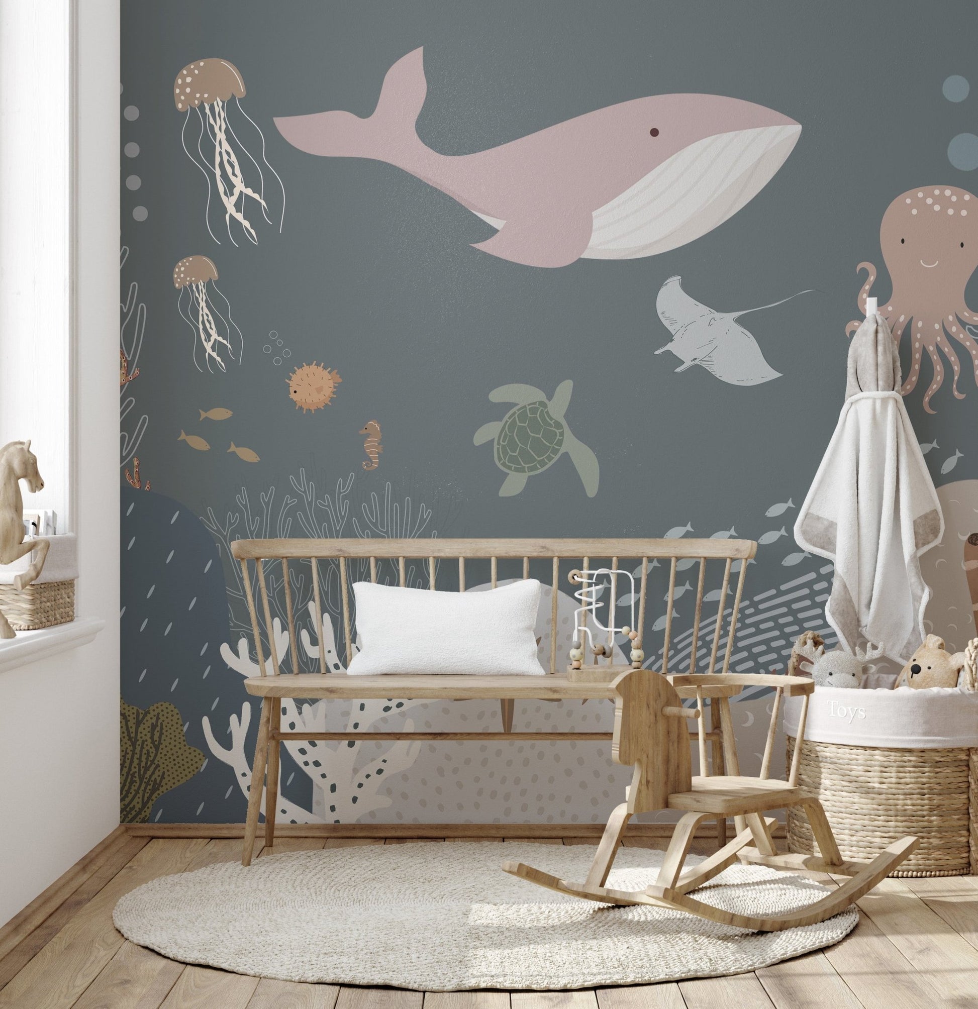 Underwater adventure mural with vibrant marine life in nursery.
