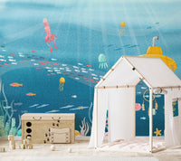 Underwater mural showcasing diverse sea life and coral reefs in nursery.

