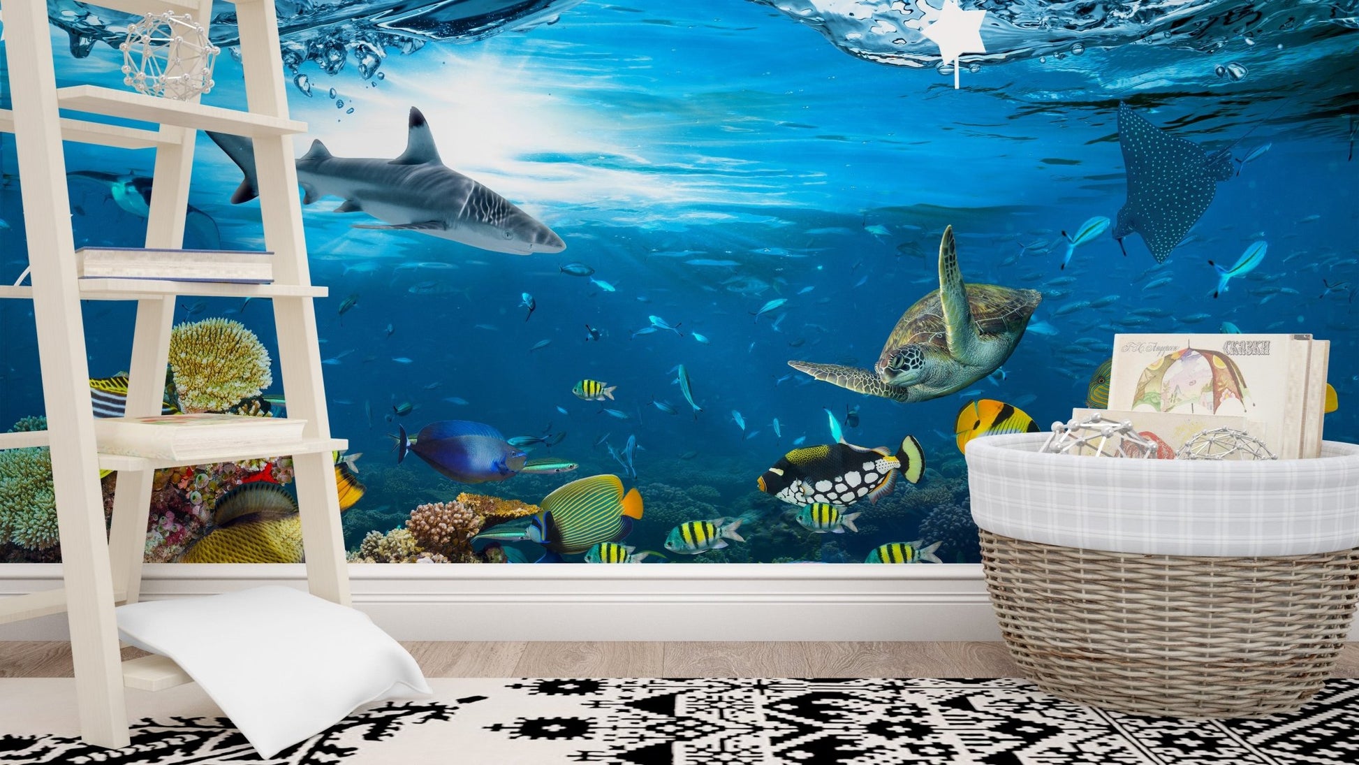 Nursery room with white ladder shelf and underwater creature wall mural.