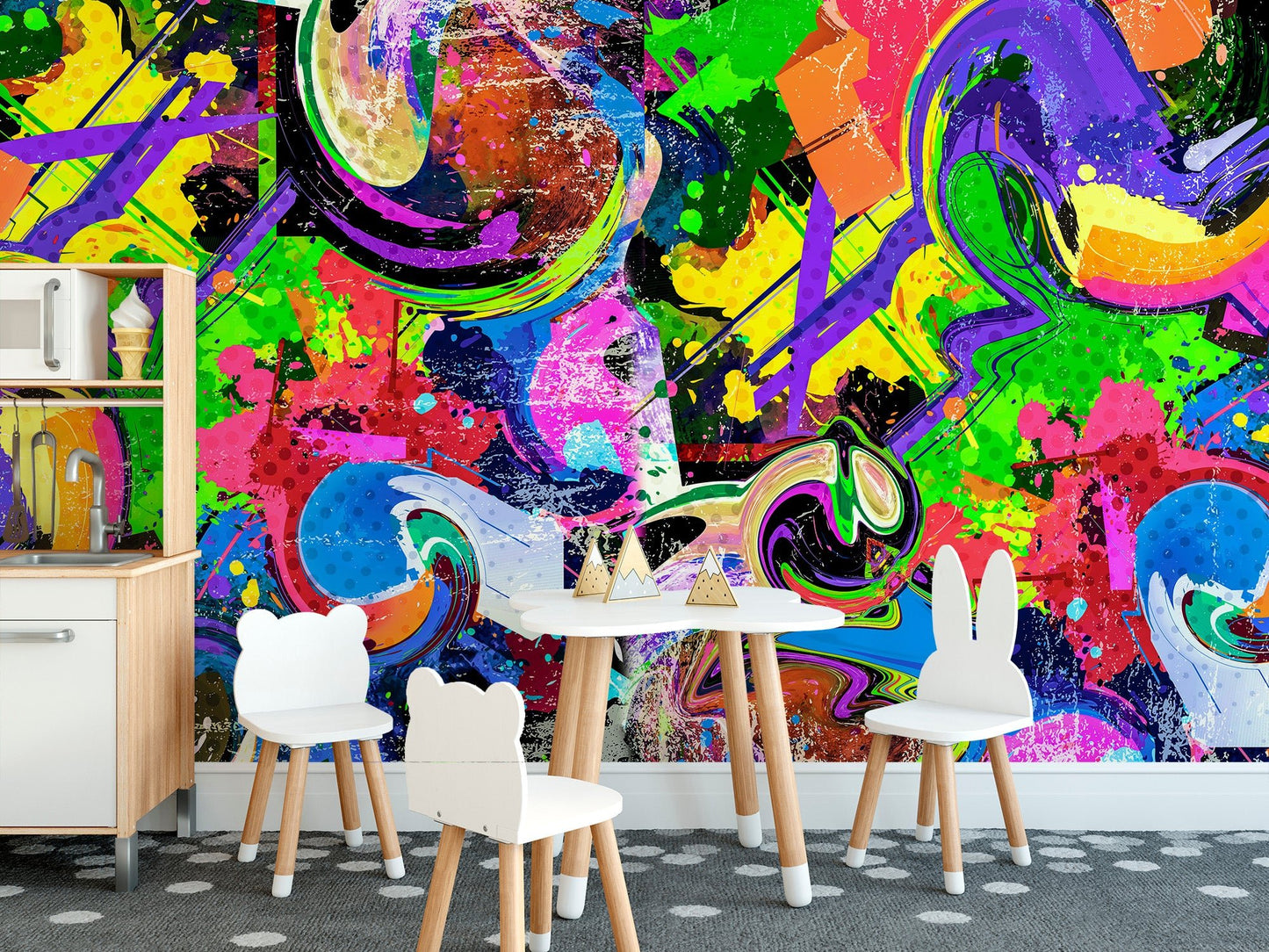 Abstract graffiti wall mural in bold pink, green and blue tones for nursery decor.