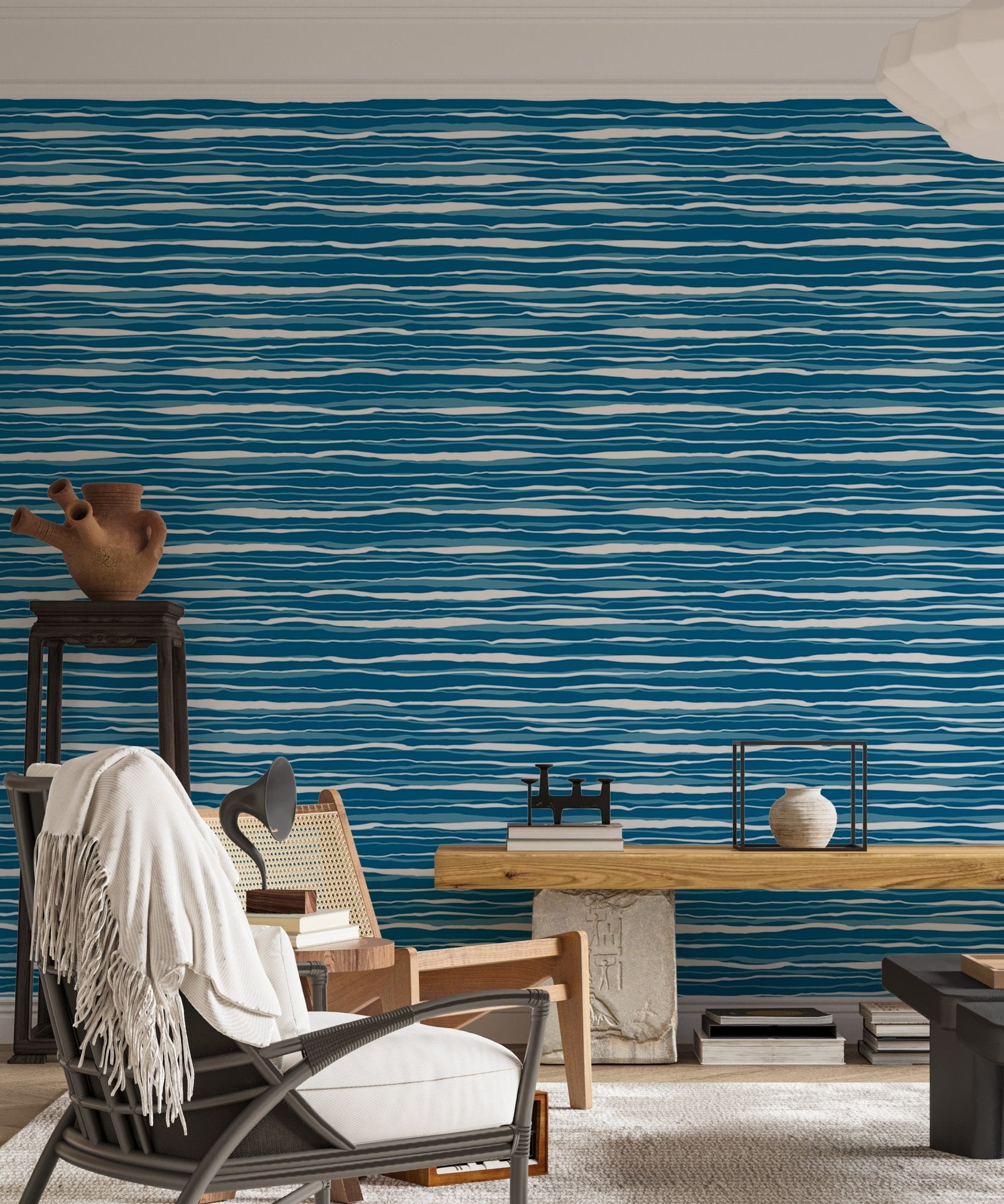 Vector blue ocean waves wallpaper in a living area with a white armchair.