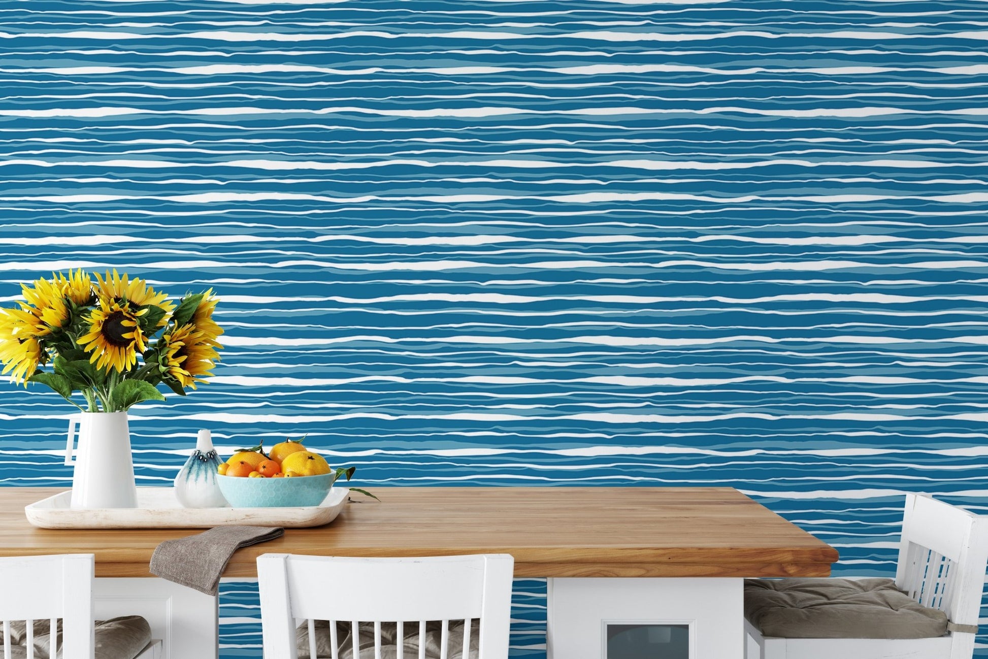 Dining room featuring blue water stripes tile wallpaper behind a wooden table.