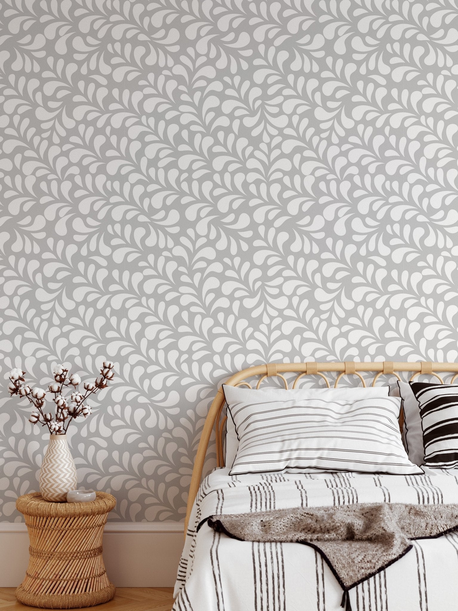 Modern white drops wallpaper in a small bedroom with a single bed.
