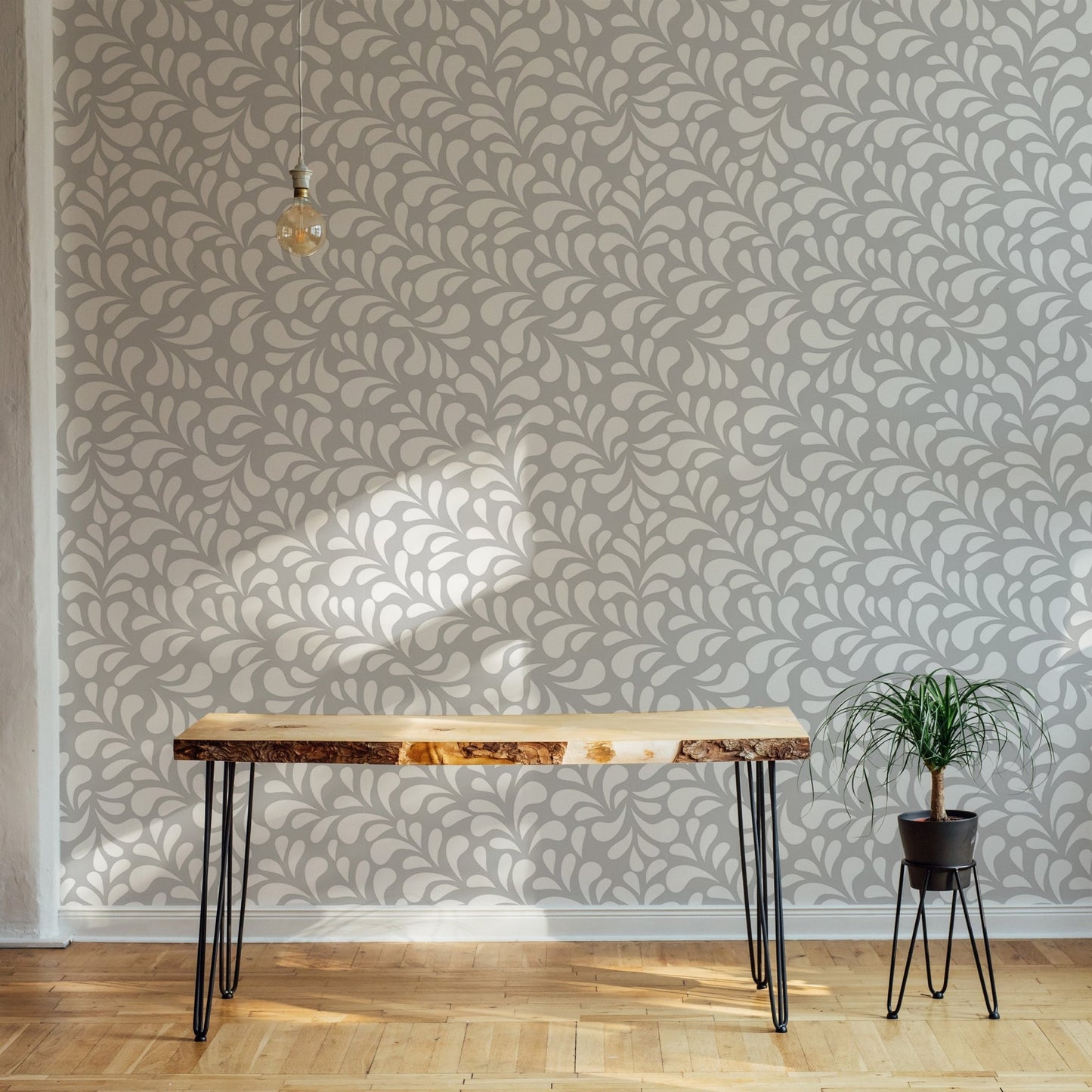 Vector Seamless White Drops Damask Wallpaper in a open space with a wooden desk.