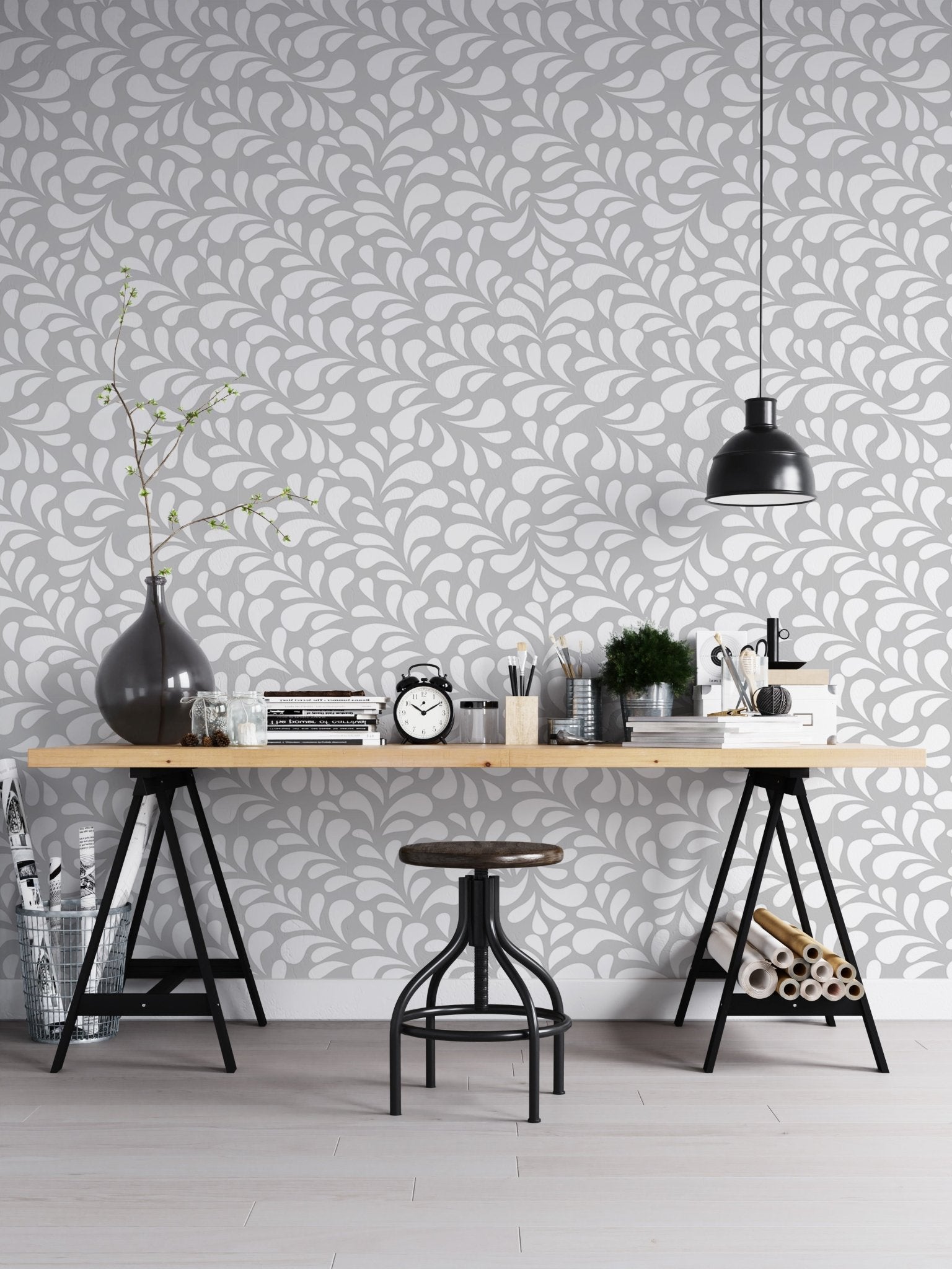 Minimalist damask wallpaper in home office space with black chair and table.