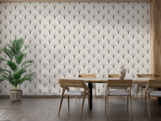 Geometric arc pattern wallpaper in a dining room with long wooden table.