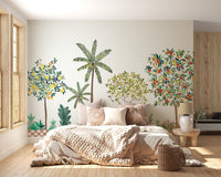 Tropical citrus tree wall mural wallpaper in muted green tones.