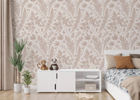 Botanical leaf wallpaper in a kids room with a white cabinet and indoor plants.