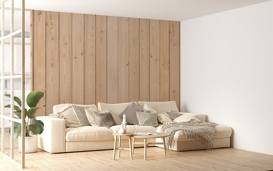 Vertical Striped Wood Elegance wall mural behind a comfortable sofa.