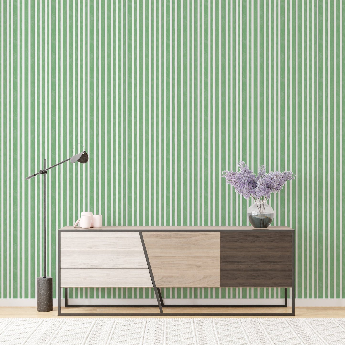 Console table against watercolor green stripes vintage wallpaper.