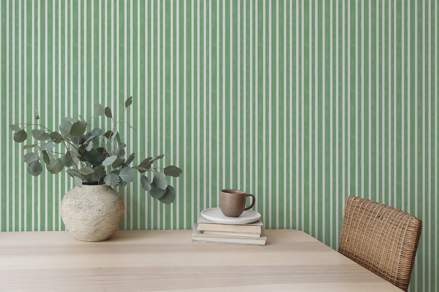 Study area desk with green vertical striped wallpaper background.