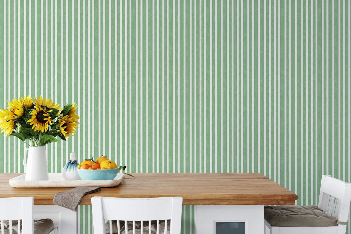Dining space with striped green vintage wallpaper and wooden table.