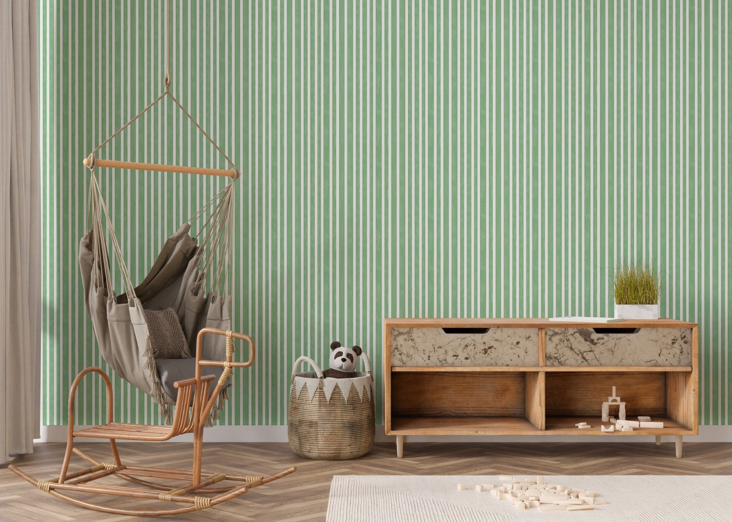 Living corner with hanging chair and green striped wallpaper.