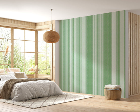 Bedroom wall decor showing vertical watercolor green wallpaper.