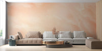 Pastel watercolor wallpaper with blended peach and beige tones on home office wall.