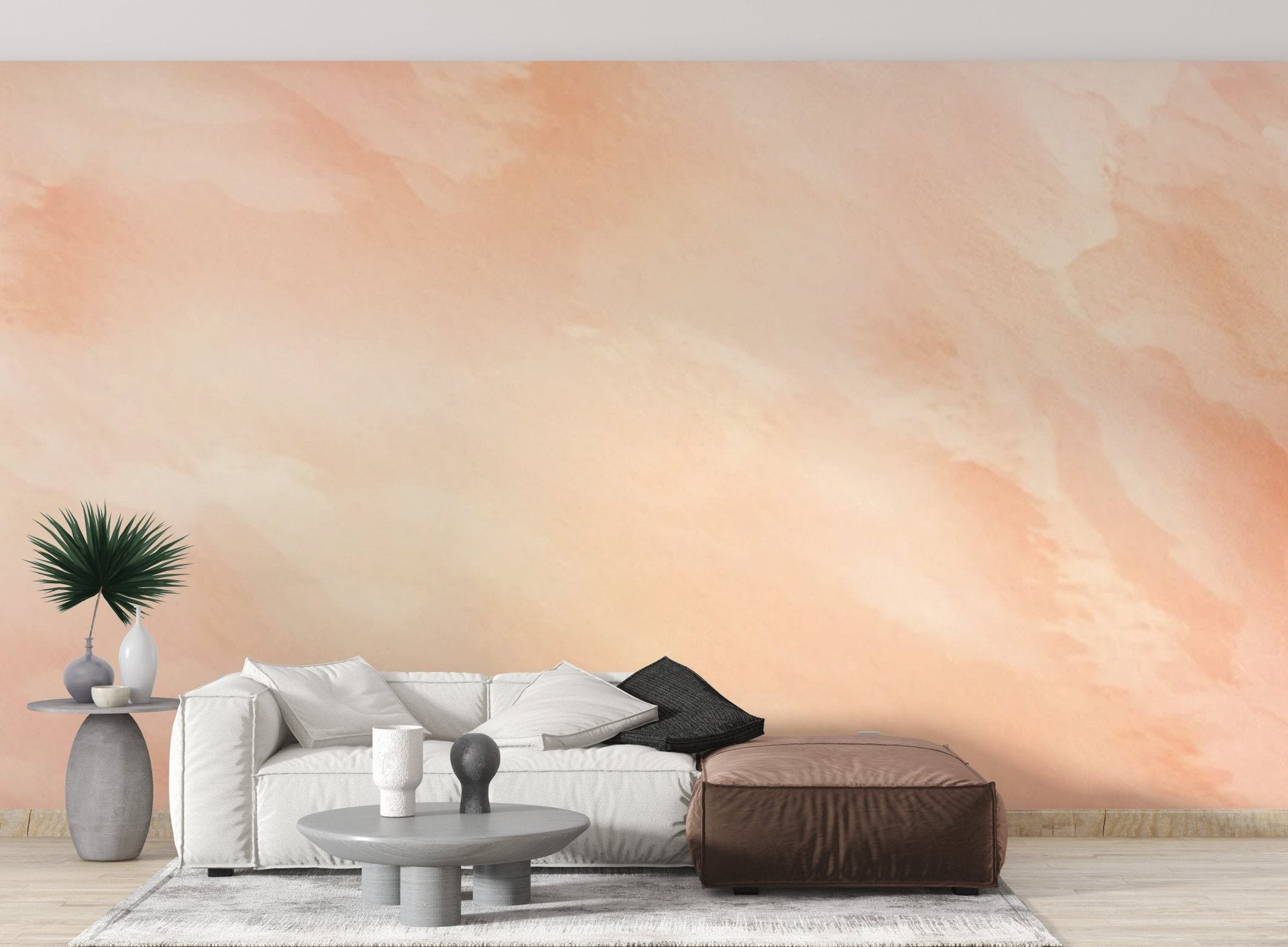 Soft peach watercolor wall mural with flowing abstract paint pattern for living room.