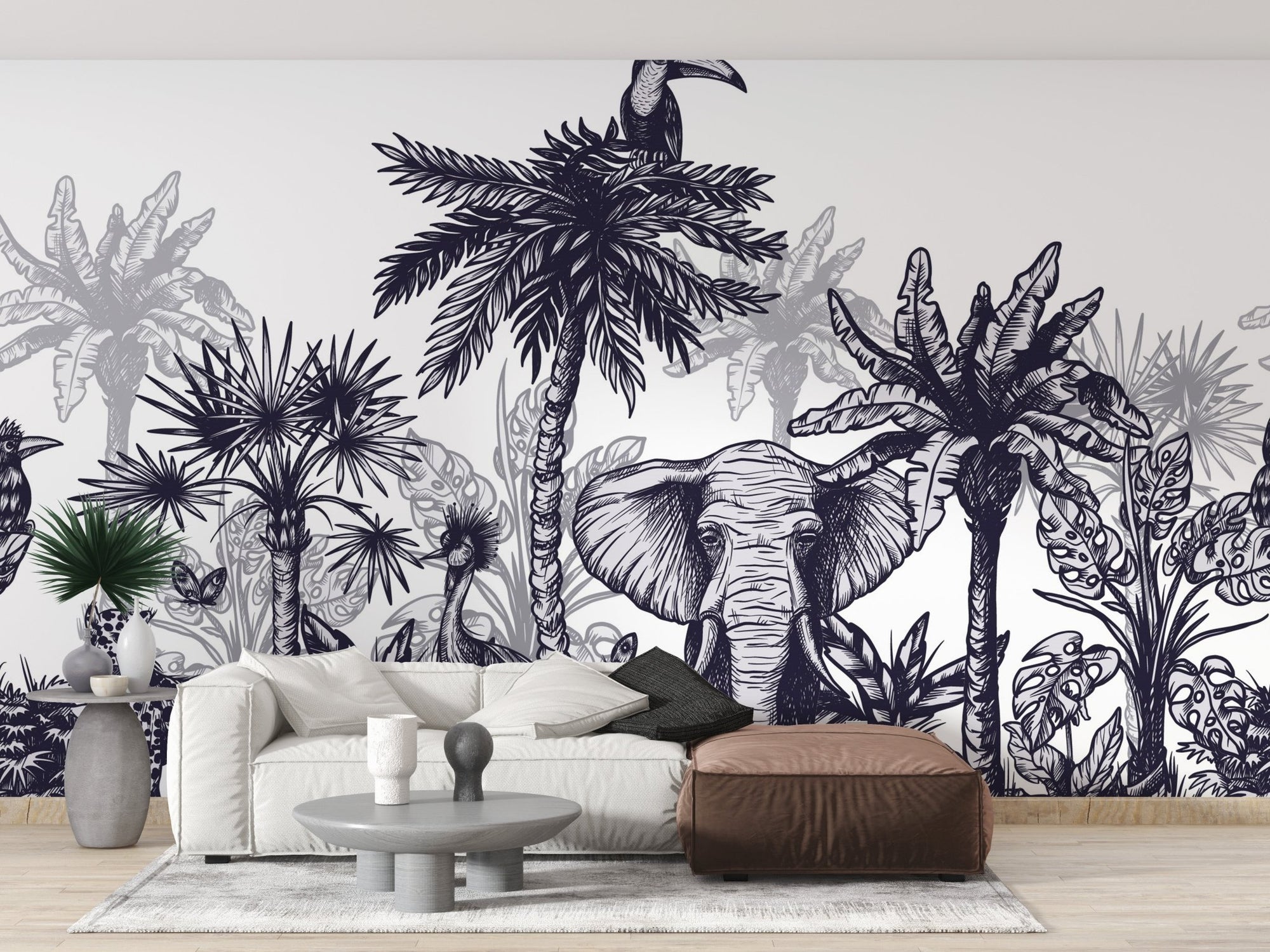 Black and white elephant mural in a modern living room with a beige sofa.